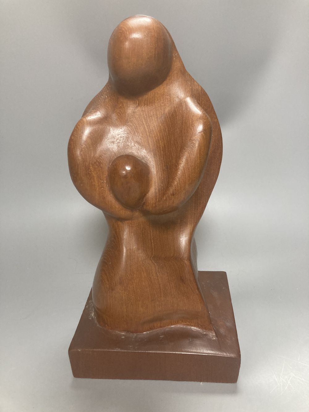 After Henry Moore, two related figural sculptures in wood and plaster, 31cm, white composition, 28cm